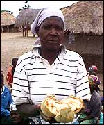 A woman holding Baobab fruit