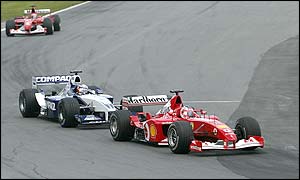 Rubens Barrichello passes Montoya to take the lead