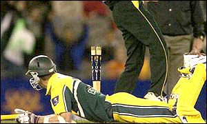 Australia's Glenn McGrath is run out by Shahid Afridi for only one run