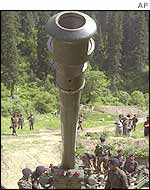 Indian soldiers prepare gun to fire across the Line of Control