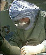 A doctor operates on an Aids victim