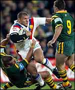 Barrie McDermott cannot find a way past Trent Barrett's tackle