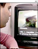 Man watches Bin Laden video