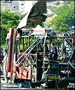 The force of the explosion left the bus a charred shell