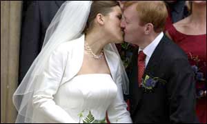 The bride and groom kiss after tying the knot