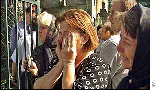 Relatives wait outside Lviv morgue