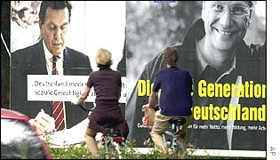 Woman walking past election posters