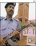 Pakistani security guard outside church