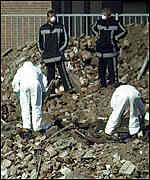 Forensics experts at the scene of the disaster 