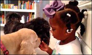 Girl cuddles dog