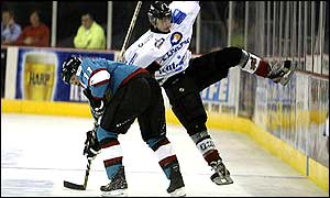Giants Colin Ward shrugs aside Thomas Bergamelli of Mulhouse