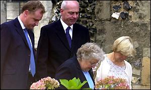 Milly's father Bob (centre) mother Sally (right) and Chief Supt Craig Denholm (left) arrive at church