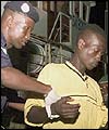 Senegalese fireman helps a survivor