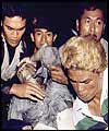 A victim is carried away from the scene of the explosion