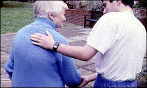 Elderly woman with carer