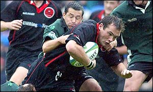 Edinburgh's Alastair Dickson is tackled by London Irish's Barry Everitt 