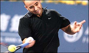 Andre Agassi plays a shot during his Masters Cup defeat to Juan Carlos Ferrero