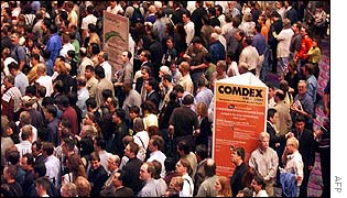 Participants wait for the doors to open for Comdex 2002