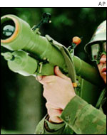 A soldier holds a shoulder-launched surface-to-air missile