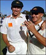 Glenn McGrath and Andy Bichel holds the replica Ashes