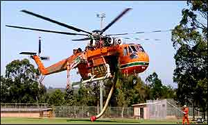 An air crane helicopter takes off on its way to water bomb fires 