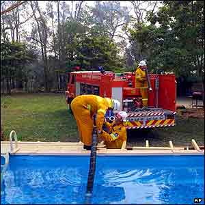 Firefighters fill up their empty truck