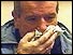 Man blowing his nose into handkerchief
