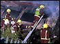firemen on the wreckage