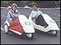 Two Sinclair C5s with drivers