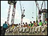 Construction workers sitting on a wall during a break at Canary Wharf