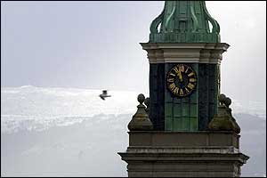 Snow is visible on the hills to the south of Dublin behind the clock tower of the Museum of Modern Art
