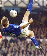 Brian McBride strikes with an overhead kick