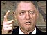 Clinton waving one finger in the air