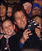 Hugh Grant with fans in Leicester Square