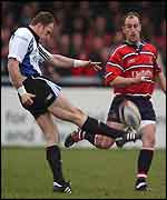 Mike Catt drops a goal against Gloucester
