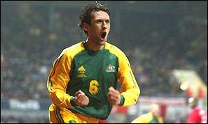 Tony Popovic celebrates scoring Australia's first goal