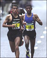 A world record time from Khalid Khannouchi edges out Kenya's Paul Tergat and Ethiopia's Haile Gebrselassie