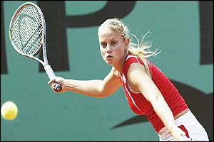 Dokic gets ready to hit a forehand to Angelika Roesch
