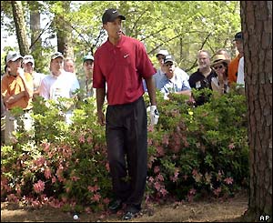 Tiger Woods is in trouble on the third and falls back to one over par