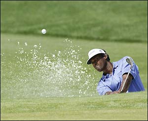 Vijay Singh plays a shot on the second
