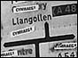 Defaced road sign in Wales