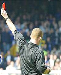 Paul Durkin shows the red card