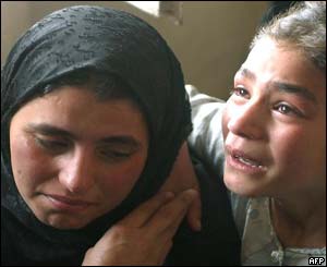 Two Iraqi women weep