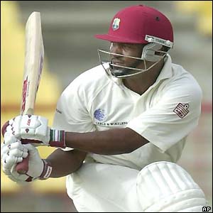 Brain Lara swats another ball for four runs