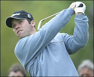 Paul Casey plays an approach shot to the second green