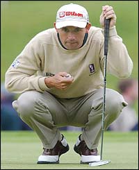 Padraig Harrington prepares to putt