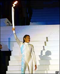 Freeman lights the Olympic flame at the 2000 Games' opening ceremony in Sydney