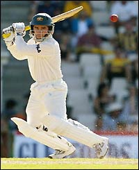 Justin Langer swats with abandon