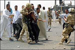 British soldiers detaining an Iraqi youth