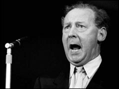 Hugh Gaitskell speaking at microphone